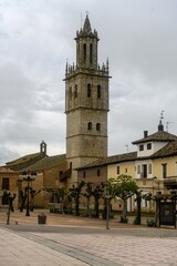 Obraz premium Gothic bell tower of San Pedro Church in Fuentes de Nava, Palencia rising over the main square