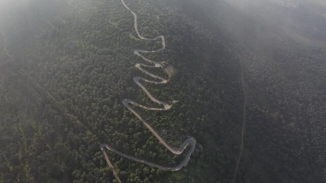 The winding road that leads to the summit of Mount Tabor in Israel from a drone