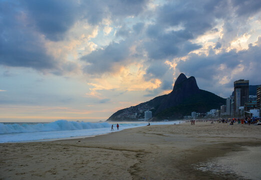 Ipanema Beach with Two Brothers Mountains (Morro Dois Irmãos) at sunset in Rio de Janeiro, Brazil