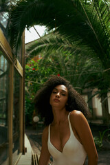 Stylish young woman exudes confidence in tropical paradise