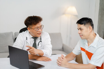 Fototapeta premium Doctor Consults with Patient in Modern Office Setting, Discussing Health and Treatment Options During a One-on-One Appointment