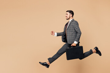 Full body side view young employee business man corporate lawyer wears classic formal grey suit...