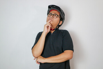 young handsome guy thinking, feeling doubtful and confused. bike concept. bike concept