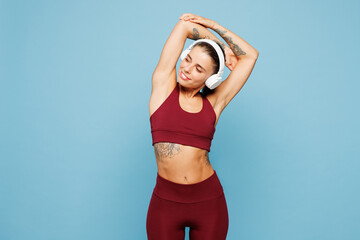 Young fitness trainer instructor sporty woman sportsman wear red sportswear train in home gym...