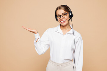 Employee operator business woman wear white classic formal shirt set microphone headset for helpline assistance work at call center office point hand aside on area isolated on grey background studio.