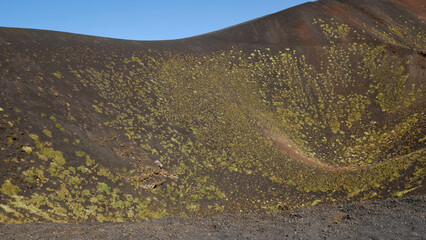 Ancient volcanic crater on Mount Etna. Geological textures and colors of volcanic rock and ash....