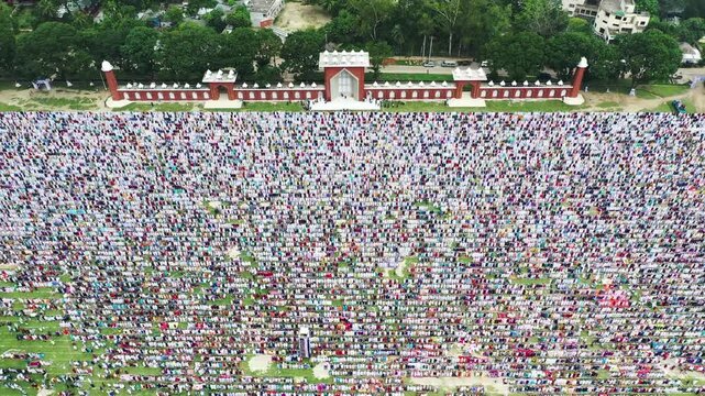Dinajpur, Bangladesh - 24 August 2025: Aerial view of a vast Eidgah ground filled with countless worshippers during prayer, a vibrant display of faith and unity.