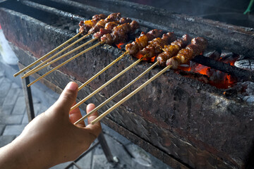 Sate Kambing or Lamb Satay, a traditional satay from Yogyakarta, Indonesia, in shallow focus