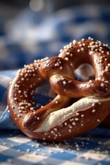 Bavarian Pretzel with Salt on Blue Checkered Cloth, Close-Up View
