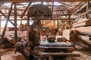 Dusty traditional wood workshop with sawdust pile