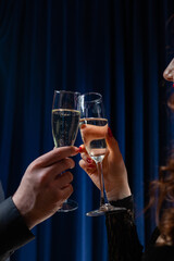 Couple toasting with glasses of red and white wine