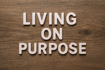 Fototapeta premium Inspirational Message: 'Living on Purpose' Typography on Wood Background for Motivation and Lifestyle Concepts