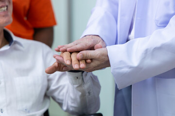 Doctor and nurse supporting happy recovering patient