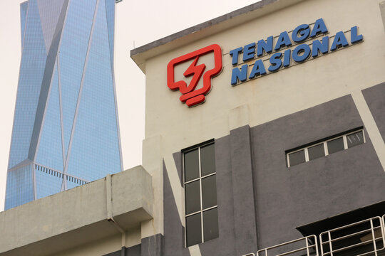 Tenaga Nasional Berhad (TNB) company logo on its headquarters building with the majestic Merdeka 118 skyscraper in the background, Kuala Lumpur, Malaysia, February 16, 2025