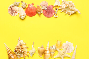 Frame made of seashells and starfishes on yellow background