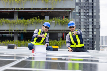 Engineers analyzing rooftop solar panel system data