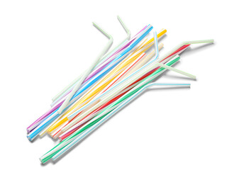 Different plastic drinking straws on white background