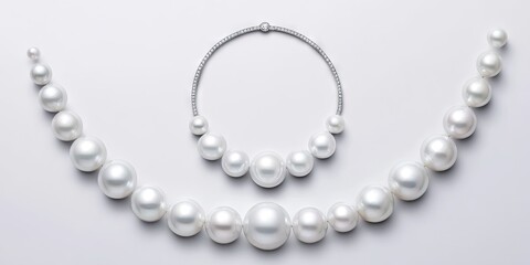 Obraz premium Elegant collection of white pearls arranged artistically with a diamond necklace, showcasing luxury jewelry design and craftsmanship in a minimalist setting