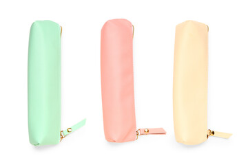 Pencil cases on white background