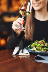 Female hand with glass of wine 