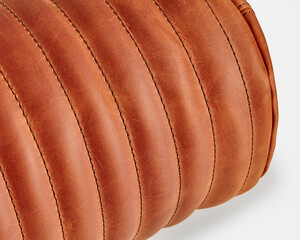 Brown leather upholstery creating a luxurious textured surface