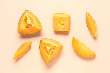 Pieces of sweet melon on pink background
