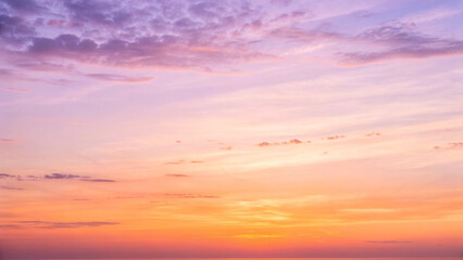 Fototapeta premium Vibrant sunset sky with colorful clouds in shades of purple pink and orange image photo