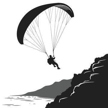 Paragliding over coastal cliffs silhouette