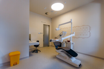 A modern dental office with a treatment chair and advanced equipment for patient comfort
