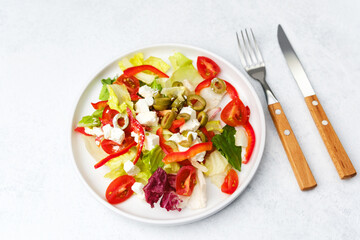 Fresh greek salad with feta cheese and vegetables for healthy eating and diet concept