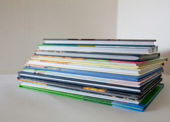 Stack of colorful books on a white background. Concept of education, reading, learning, knowledge,...