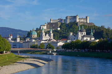 Naklejka premium Cityscape of Salzburg with the historic Hohensalzburg Fortress on hilltop, Austria