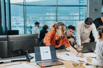 A diverse group of business colleagues engaged in a collaborative brainstorming session, showcasing...