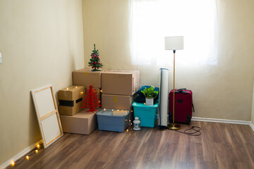 First christmas in new home: cardboard boxes and festive decorations creating cozy atmosphere