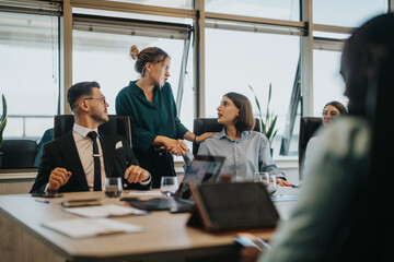 A group of multiracial business people are involved in a collaborative meeting, exchanging ideas...