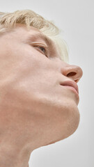 Close up of young man jawline and face with strong profile in minimal clean style. Concept of...