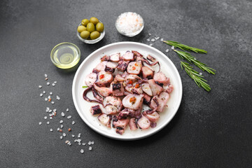 Octopus pieces in white bowl for salad preparation or healthy lunch concept