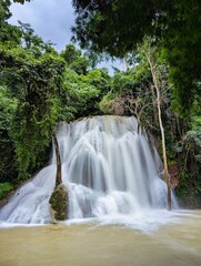 heavy water at Kuang Si Waterfall Cascading Through Lush Jungle in Luang Prabang, Laos – Tropical Nature Escape