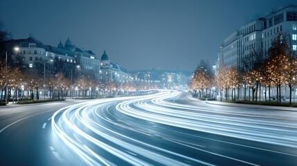 Obraz premium Night City Street with Light Trails from Moving Vehicles