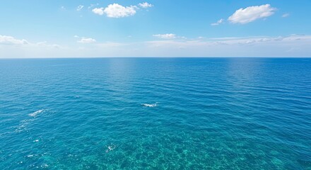 Obraz premium Serene Ocean Expanse Under a Cloud-Kissed Sky