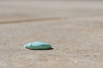 Used chewing gum spit out on the pavement