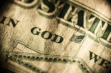 Showcases close-up of hundred dollar bill focusing on 