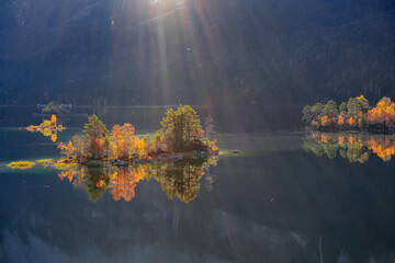Fabulous autumn  landscape of islands with pine-trees in the middle of Eibsee lake.