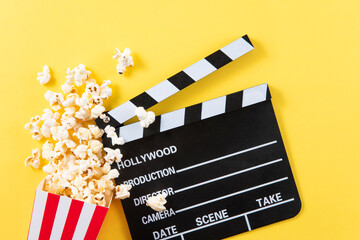 movie clapper board with popcorn	