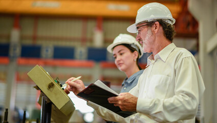 woman engineer assistant secretary in helmet inspection check control heavy machine construction...