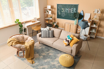 Interior of living room with blackboard, palm plants and sofa