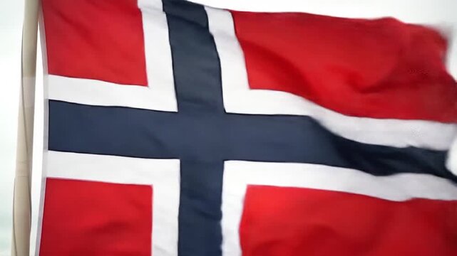 Red, white, and dark blue flag waving gently in a breeze