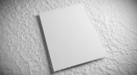 Minimalist presentation of a blank white sheet on crumpled paper texture