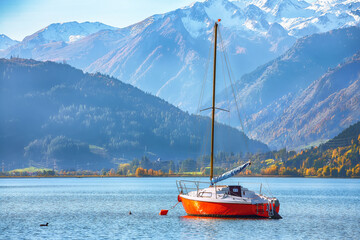Fototapeta premium Amazing autumn view of lake and yachts in city Sell Am See.