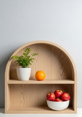 Elegant minimalist wooden shelf adorned with vibrant fruits and lush greenery display